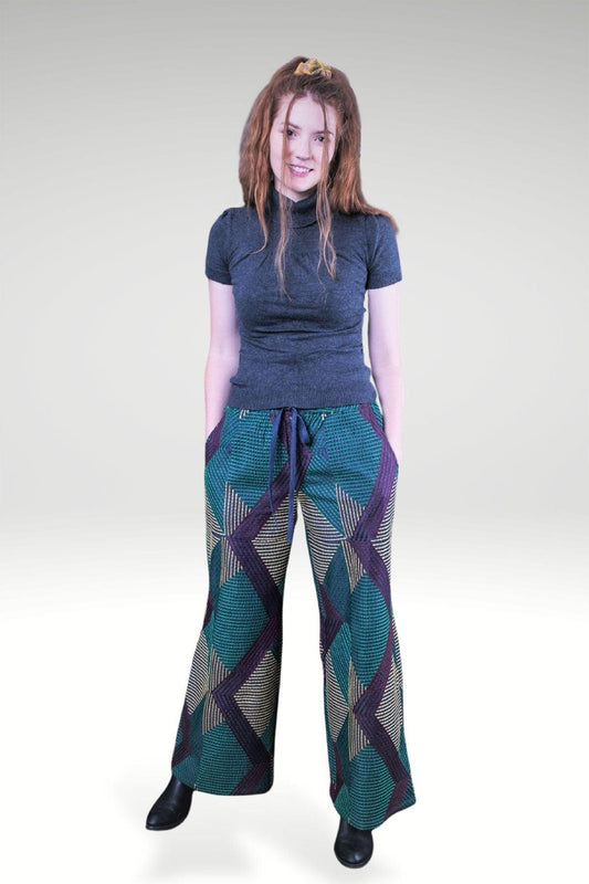 model wearing DONNATELLA EMBROIDERED WIDE-LEG PANTS - zohaonline with hands in pockets