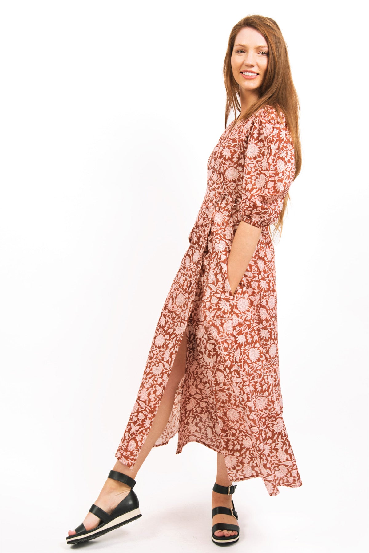 SIDE VIEW OF MODEL WEARING ZEPHYR PRINTED WRAP MAXI DRESS -IN AMBER COLOUR- zoha online