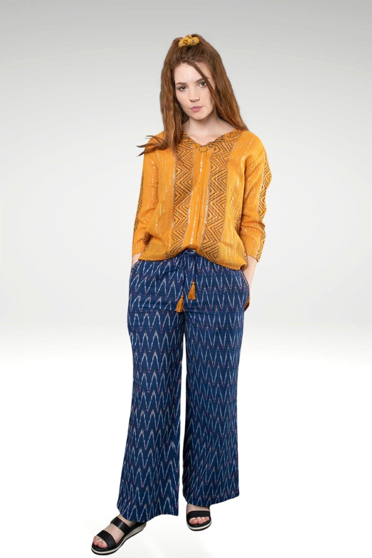 model wearing KIA IKAT PANTS with pockets, elastic waistband and tassel ties - zohaonline