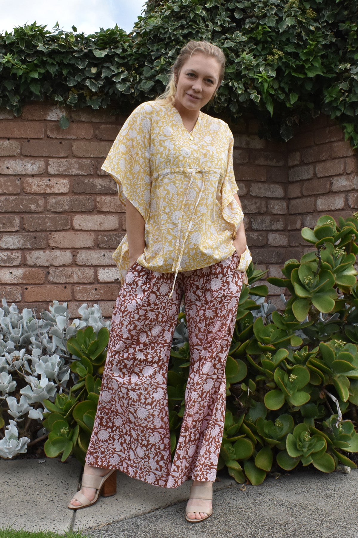 PERFECT SHOT WITH HANDS IN POCKETS-ZINNIA SHORT KAFTAN TOP WORN WITH AMBER PANTS- zohaonline
