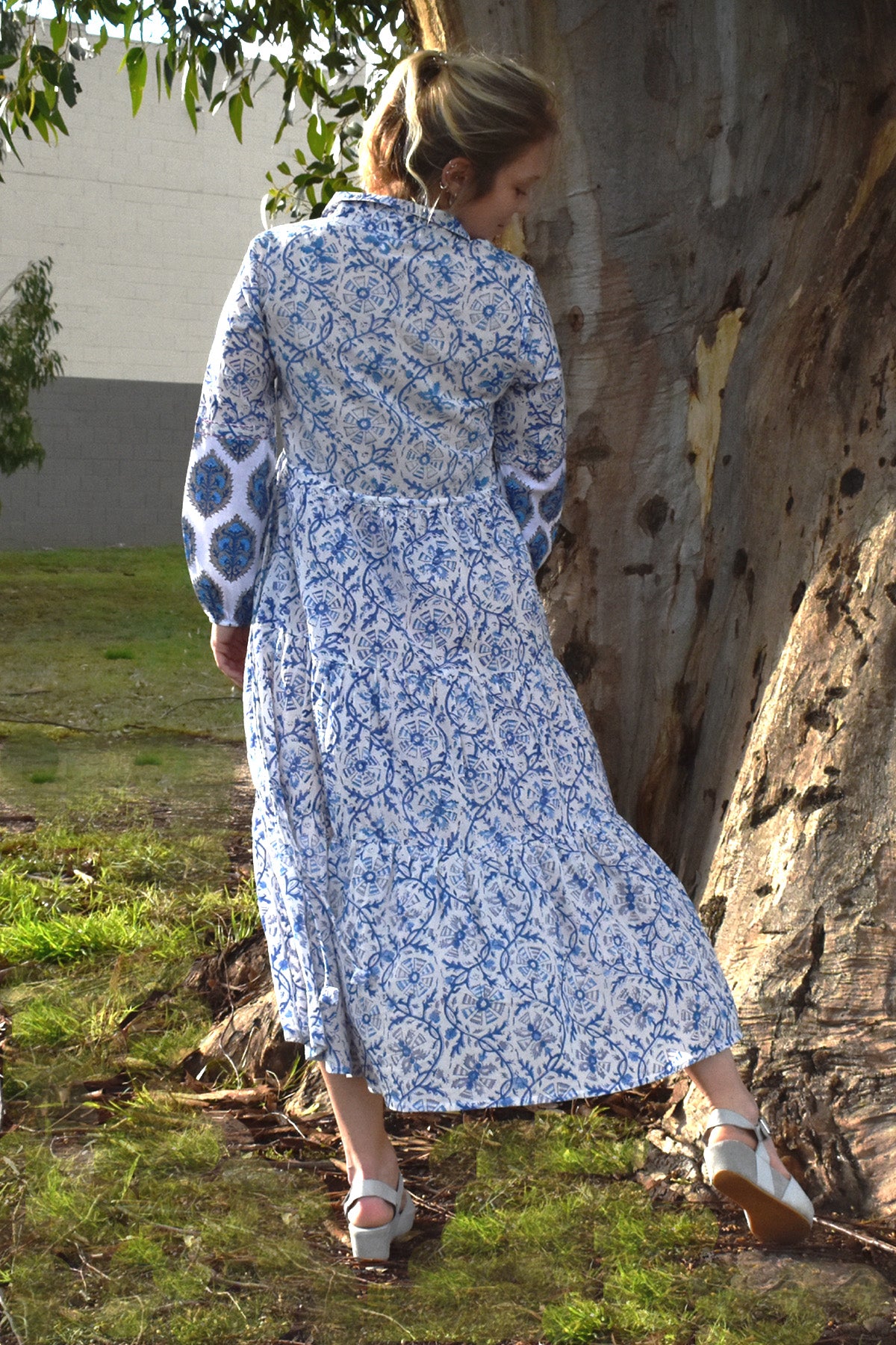 IRIS PRINTED TIERED MAXI DRESS - IN NATURAL SETTING WITH TREE IN BACKGROUND- zohaonline