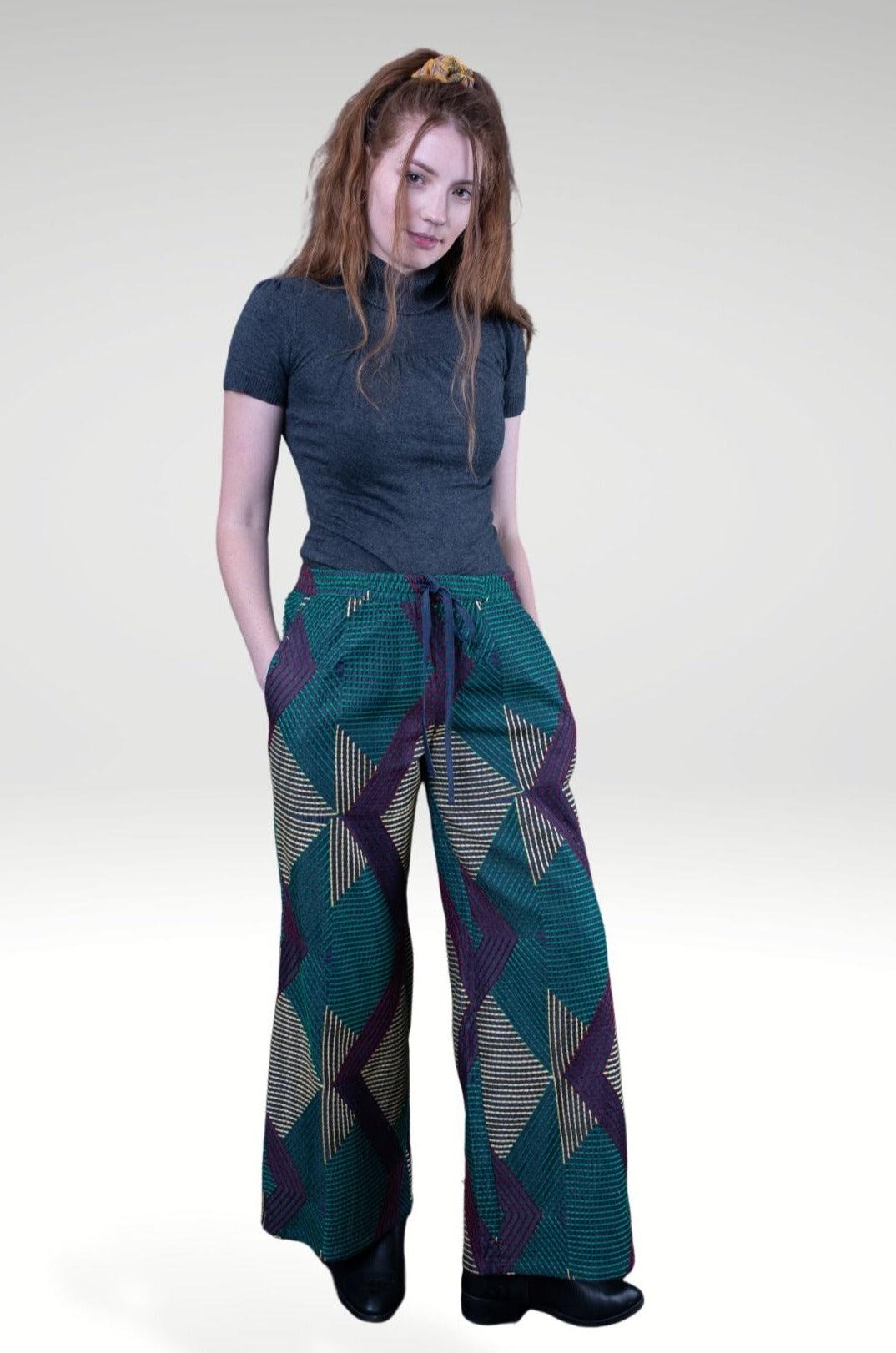DONNATELLA EMBROIDERED WIDE-LEG PANTS - zohaonline- worn by the model with high neck knit top.