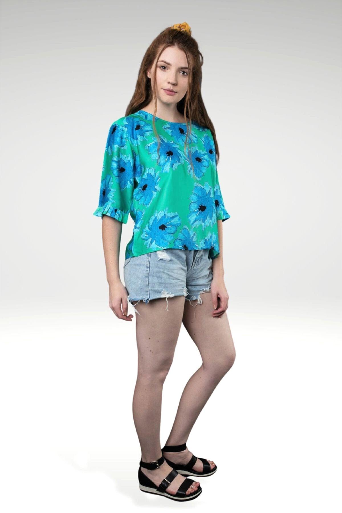 LARA FLORAL TOP - zohaonline= mint blue- sideview on model showing pleated trim on sleeve