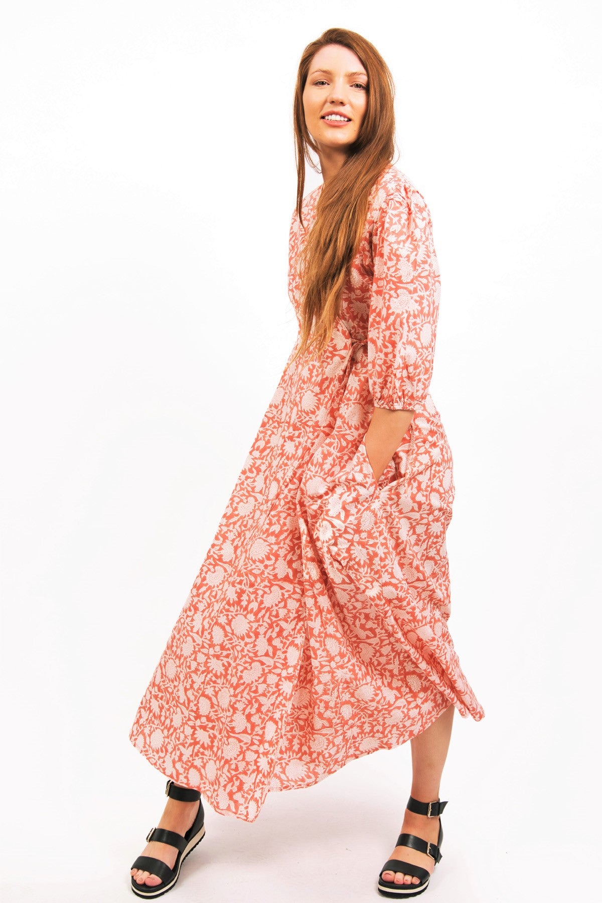 ZEPHYR PRINTED WRAP MAXI DRESS -FAWN COLOR- WORN BY MODEL  WITH HANDS IN POCKETS- zohaonline