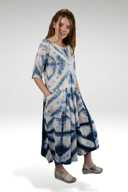 NOREEN SHIBORI DRESS - zohaonline  Model posing in this tie and dye dresss with hands in pockets