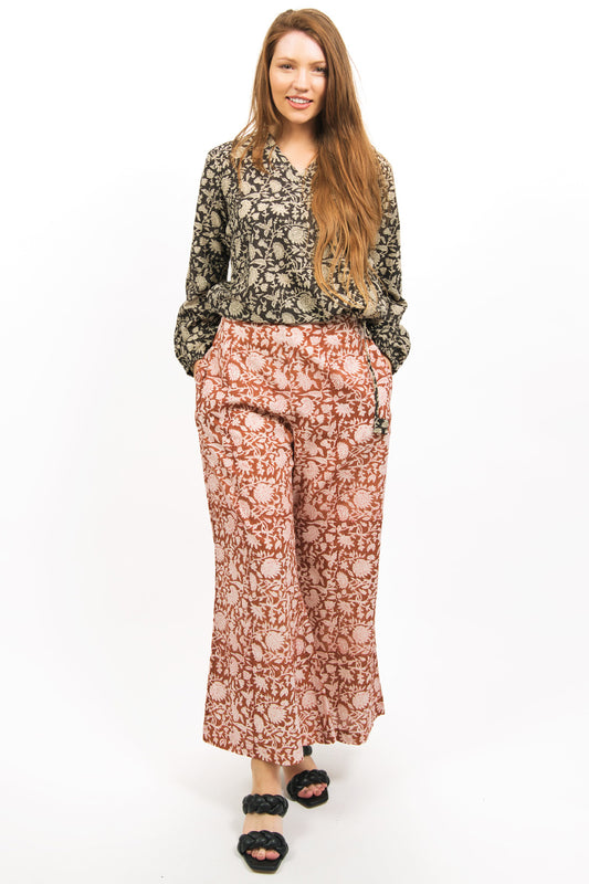 front view of model wearing AMBER FLARE PANTS  with SABLE top- zohaonline