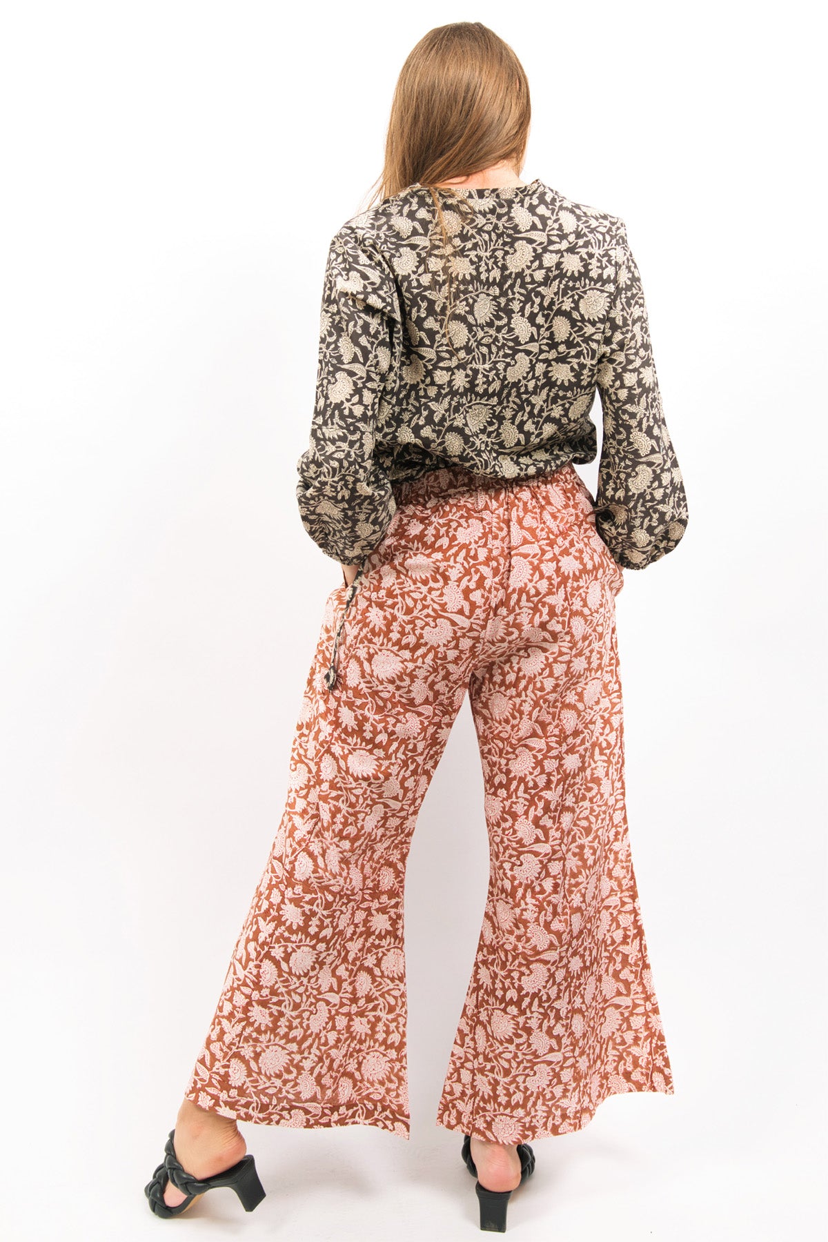 BACK VIEW OF AMBER FLARE PANTS WITH BLOCK PRINT- zohaonline