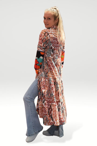 SIDE VIEW OF TOZI PRINTED TIERED MAXI DRESS WITH FLARED JEANS - zohaonline