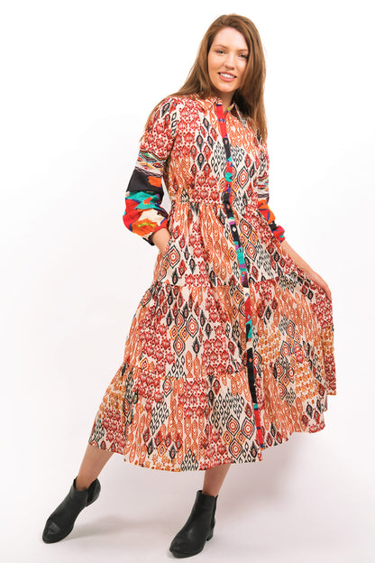 MODEL SHOWING THE FLOWING TOZI PRINTED TIERED MAXI DRESS WORN WITH BOOTS - zohaonline