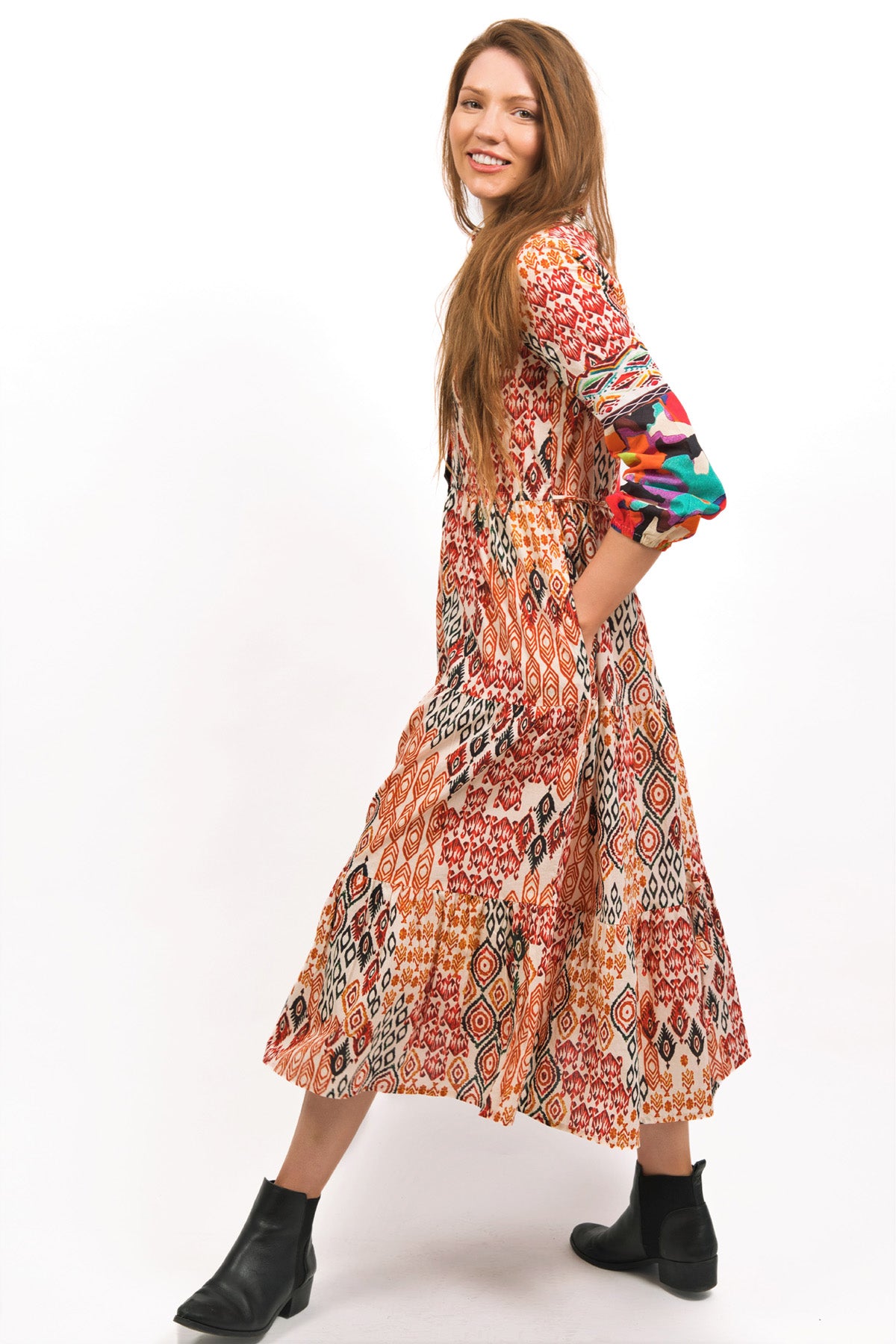 MODEL DISPLAYING TOZI PRINTED TIERED MAXI DRESS IN WALKING STANCE- zohaonline