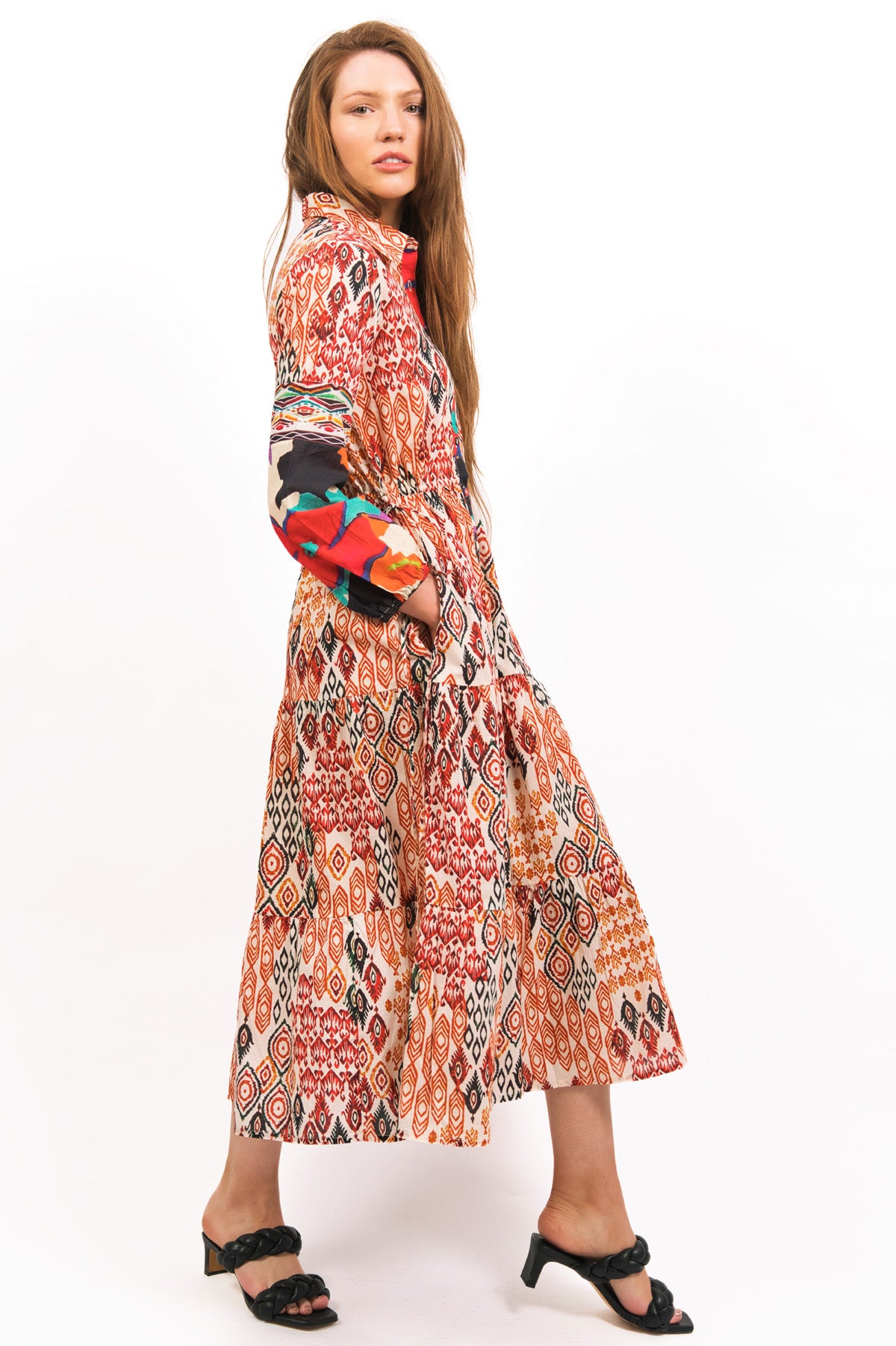 TOZI PRINTED TIERED MAXI DRESS SIDE VIEW WORN WITH HANDS IN POCKETS- zohaonline